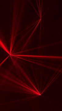 Vertical video - high speed laser light show on black background with flashing red colored laser beams. This music performance nightlife background animation is full HD and a seamless loop.