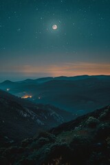 a landscape of mountains and the moon