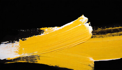 Hand painted stroke of yellow paint brush isolated on black background. Abstract stroke.