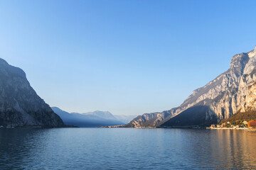 Mountain landscape, picturesque mountain lake in the summer morning, large panorama, landscape with fabulous lake view from the top of the mountain, with view of city. Como, Italy