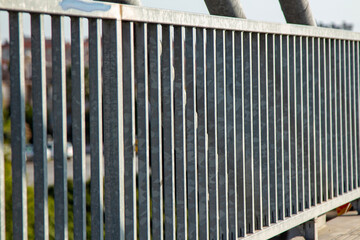 Close-up view of the steel structure of a modern bridge. Close-up of metal fence on the street....