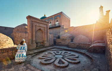 Woman tourist at old city Khiva in Uzbekistan - 780498591