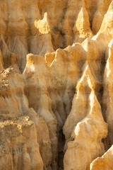 A rocky, mountainous landscape with a lot of texture and depth. The rocks are jagged and rough, and the overall mood of the image is one of ruggedness and natural beauty