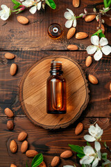 Almond essential oil in a bottle. Selective focus.