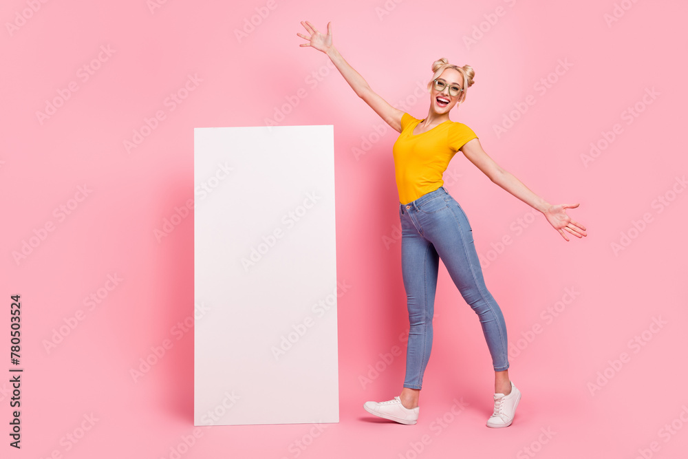 Poster Full body photo of impressed blond lady near promo wear eyewear t-shirt jeans shoes isolated on pink background