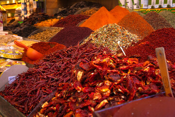 Close-up of a variety of colorful spices at the Egyptian Bazaar in Istanbul, Turkey. Selective focus, copy space, colorful background of dried spices.