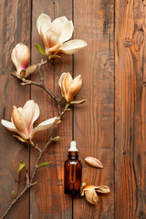 magnolia essential oil in a bottle. Selective focus.