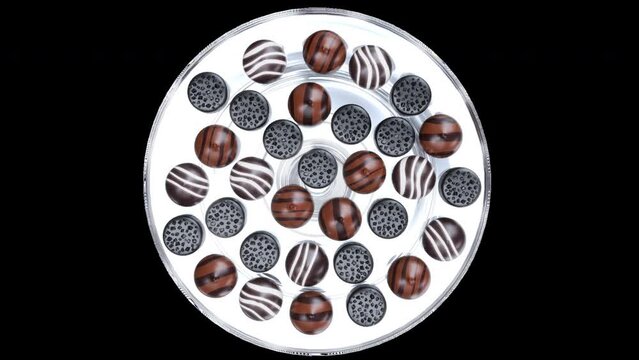 Delicious chocolate pralines, different shapes with transparent background alpha channel. Camera on top view angle