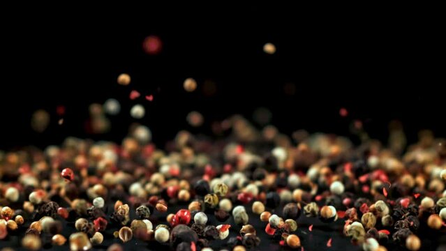 Super slow motion peppercorn falls. High quality FullHD footage