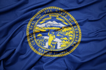 big waving national flag of nebraska state. macro shot