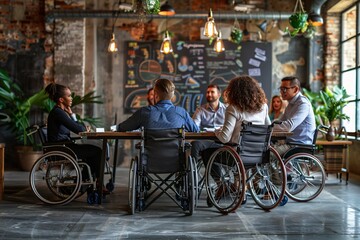 A team of professionals, including a disabled colleague, meet to discuss inclusivity and welcome a young businessman.