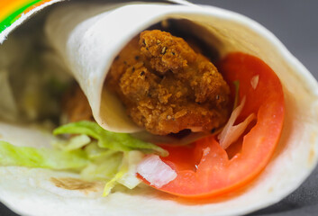 Chicken Roll (chicken, tomatoes, lettuce and sauce) when served