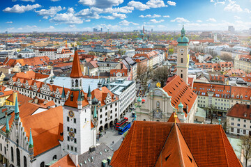 Elevated view of the skyline of Munich, Germany, with the old townhall and Heilig Geist church during a sunny day - 780525531