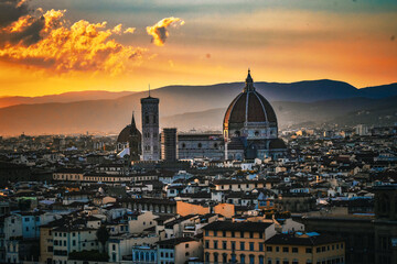 Picturesque Florence in the golden lights of a setting sun 