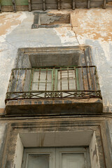 Fototapeta na wymiar Antique Balcony on Distressed Urban Building