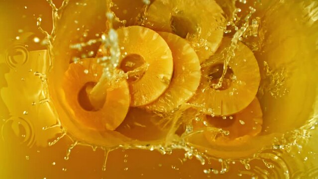 Super slow motion pineapple juice. High quality FullHD footage