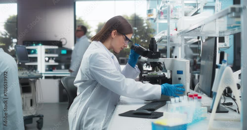 Leinwandbilder portrait of a beautiful caucasian student working on a research project in university. medical resea