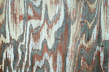 Old multicolored painted wooden surface closeup