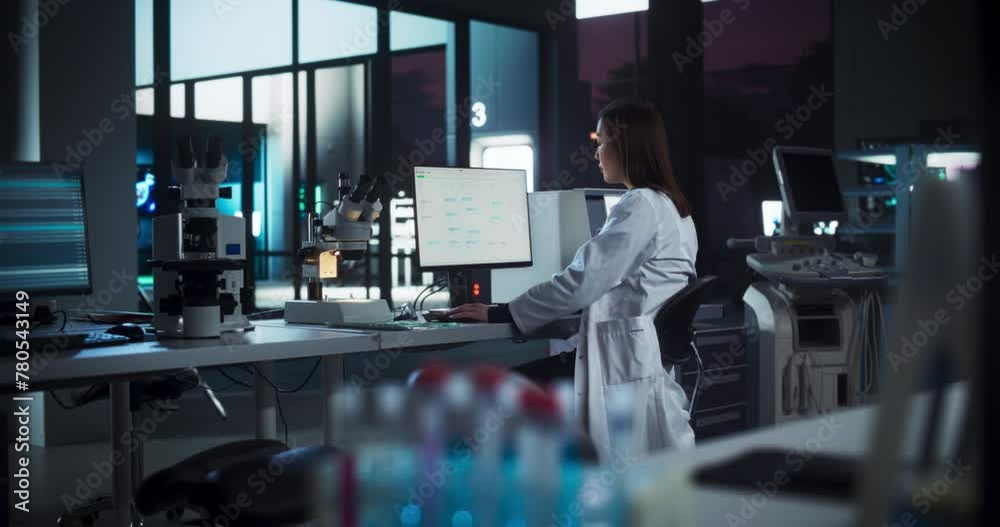 Poster asian female scientist working on a desktop computer, analyzing dna samples alone in the evening. ad