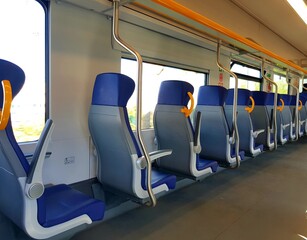 Interior of a modern train with blue seats