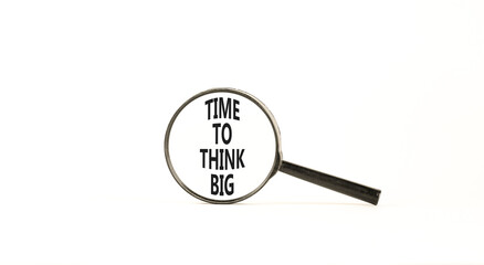 Time to think big symbol. Concept words Time to think big on beautiful magnifying glass. Beautiful white table white background. Business and time to think big concept. Copy space.