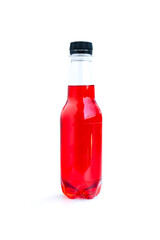 Beverage bottle with a red drink isolated on white background, Red drink in plastic bottle