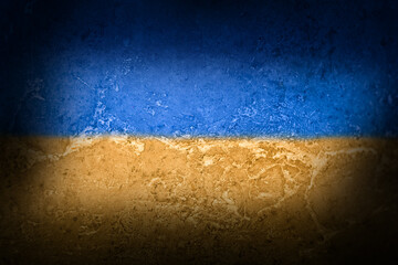 Flag of the Ukraine on a textured background. Concrete Wall in the colors of Ukraine. © ELuki