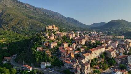 Aerial view of Corte old town, Corsica island. Morning shot of old houses on the hill in Corte village, Corsica, France