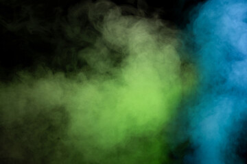 Obraz na płótnie Canvas Green and white steam on a black background.