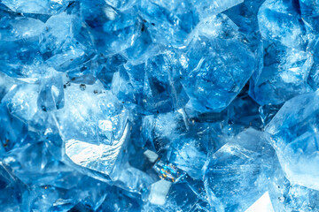 Blue Crystal Mineral Stone. Gems. Mineral crystals in the natural environment. Texture of precious and semiprecious stones. Seamless background with copy space colored shiny surface of precious stones