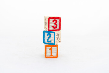 Colorful blocks with numbers stacked isolated on white background
