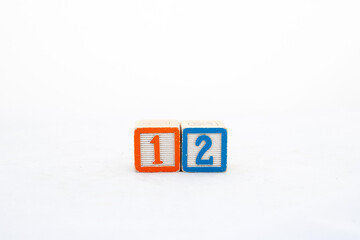 Wooden block one and two number on white background with copy space