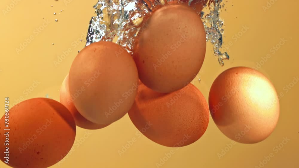 Sticker super slow motion eggs fall under water with bubbles. high quality fullhd footage