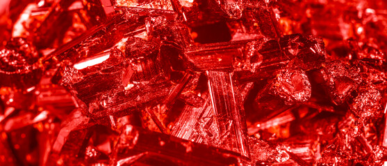 Amethyst red crystals. Gems. Mineral crystals in the natural environment. Texture of precious and semiprecious stones. Seamless background with copy space colored shiny surface of precious stones.