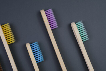  Toothbrushes on a grey backgorund. Eco-friendly toothbrushes..Health Care, Stomatology banner 