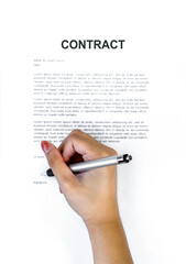 Closeup woman hand holding a pen signing her name on a CONTRACT document. Top View