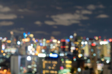 Bokeh abstract background of skyscraper buildings in Bangkok city, Thailand with lights, Blurry...