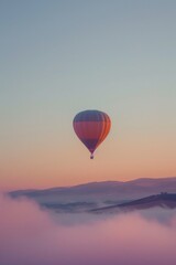 Fototapeta premium Serene Hot Air Balloon Flight Over Misty Sunrise Landscape