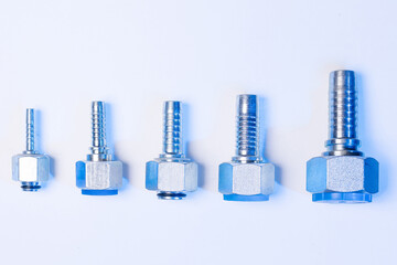 Set metal hydraulic hoses on white background with blue light