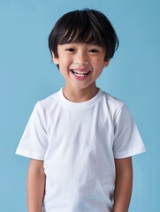 Cheerful Asian toddler in white t-shirt, clear pastel backdrop, great for showcasing in a t-shirt shop catalog.