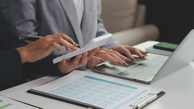 Financial Business team present. Business man hands hold documents with financial statistic stock photo, discussion, and analysis report data the charts and graphs. Finance Financial concept