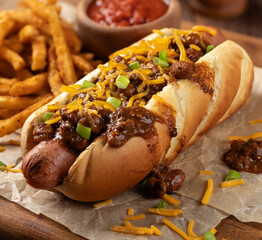 Chili hot dog with shredded cheese and green onions - 780599318