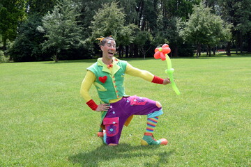Fototapeta premium Circus juggler portrait. Clown juggling with objects.