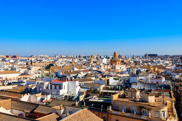 Aerial panoramic view of the old city rooftops from the Giralda Tower in Seville, Andalusia, Spain