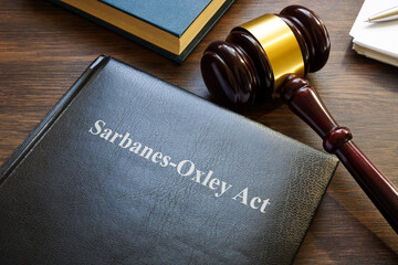 Sarbanes-Oxley act. A book with laws and gavel on the table.