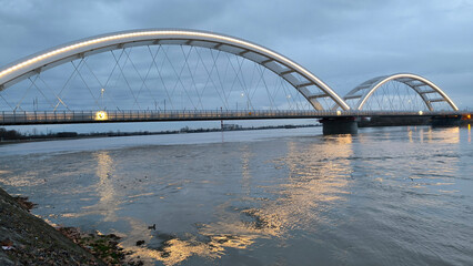 Fototapeta na wymiar panoramic view of the bridge over Danube river in Novi sad, reflected in the water surface 