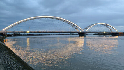 panoramic view of the bridge over Danube river in Novi sad, reflected in the water surface 