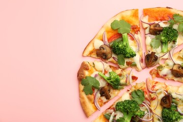 Delicious vegetarian pizza on pink table, top view. Space for text