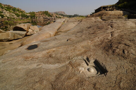 Tungabhadra River and stone cut Shiva Linga, Hampi, Karnataka, India
