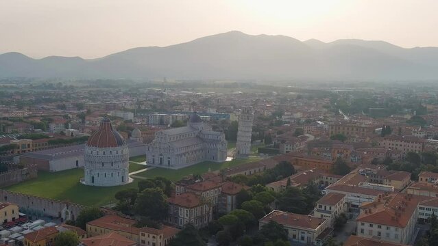 Dolly zoom. Pisa, Italy. Famous Leaning Tower and Pisa Cathedral in Piazza dei Miracoli. Summer. Morning hours, Aerial View, Point of interest